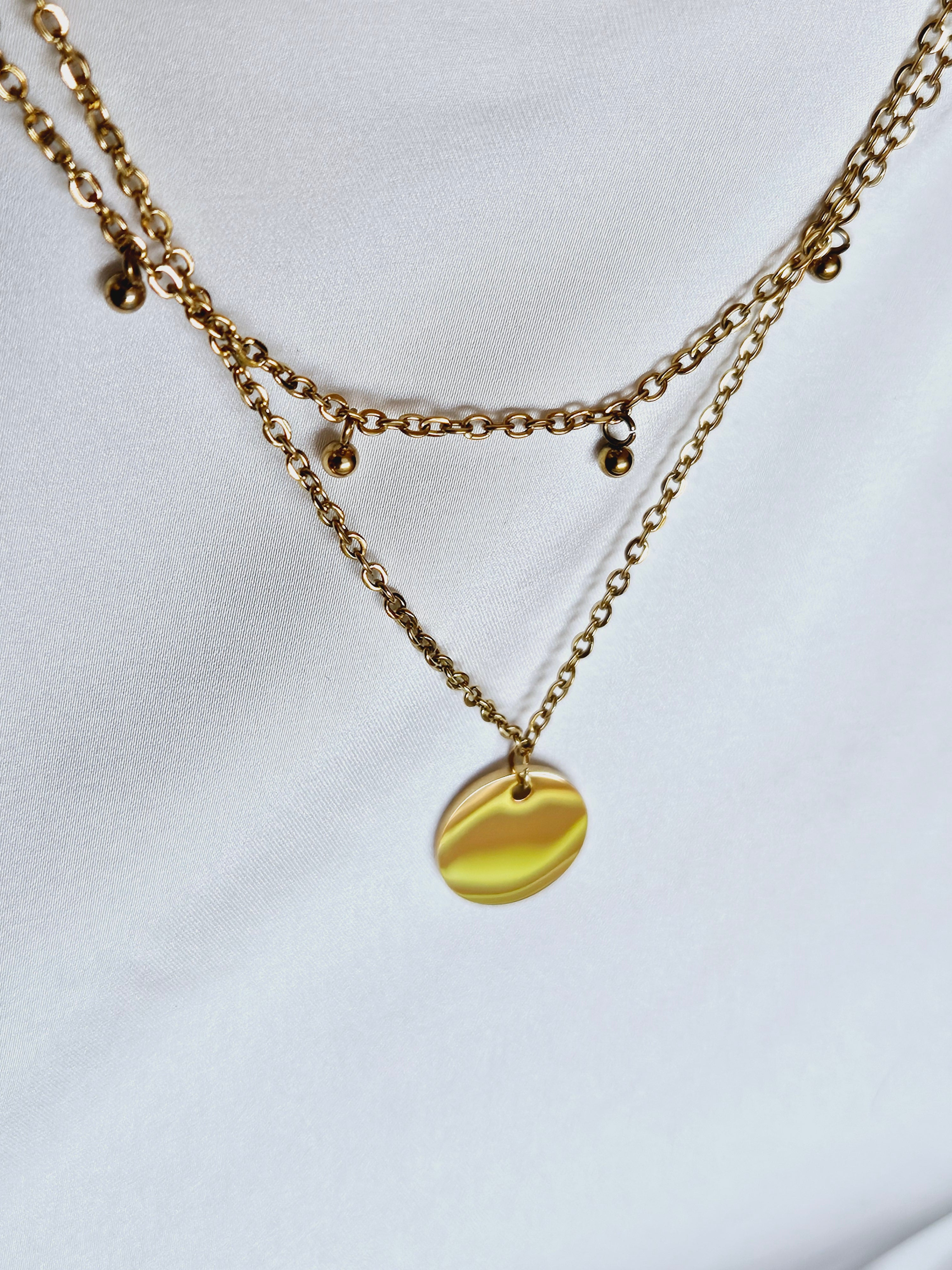 Double Layer with Medallion Pendent