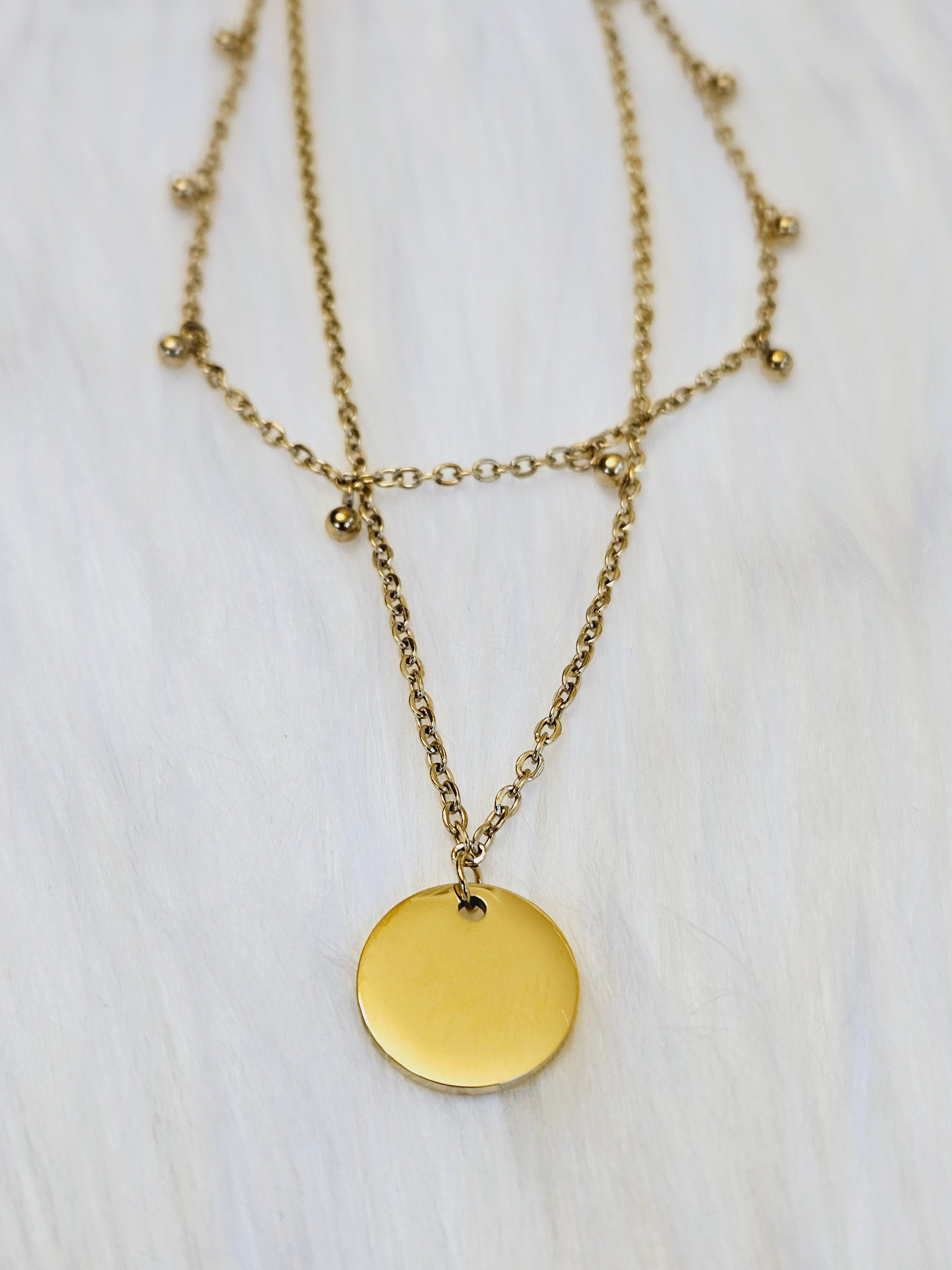 Double Layer with Medallion Pendent