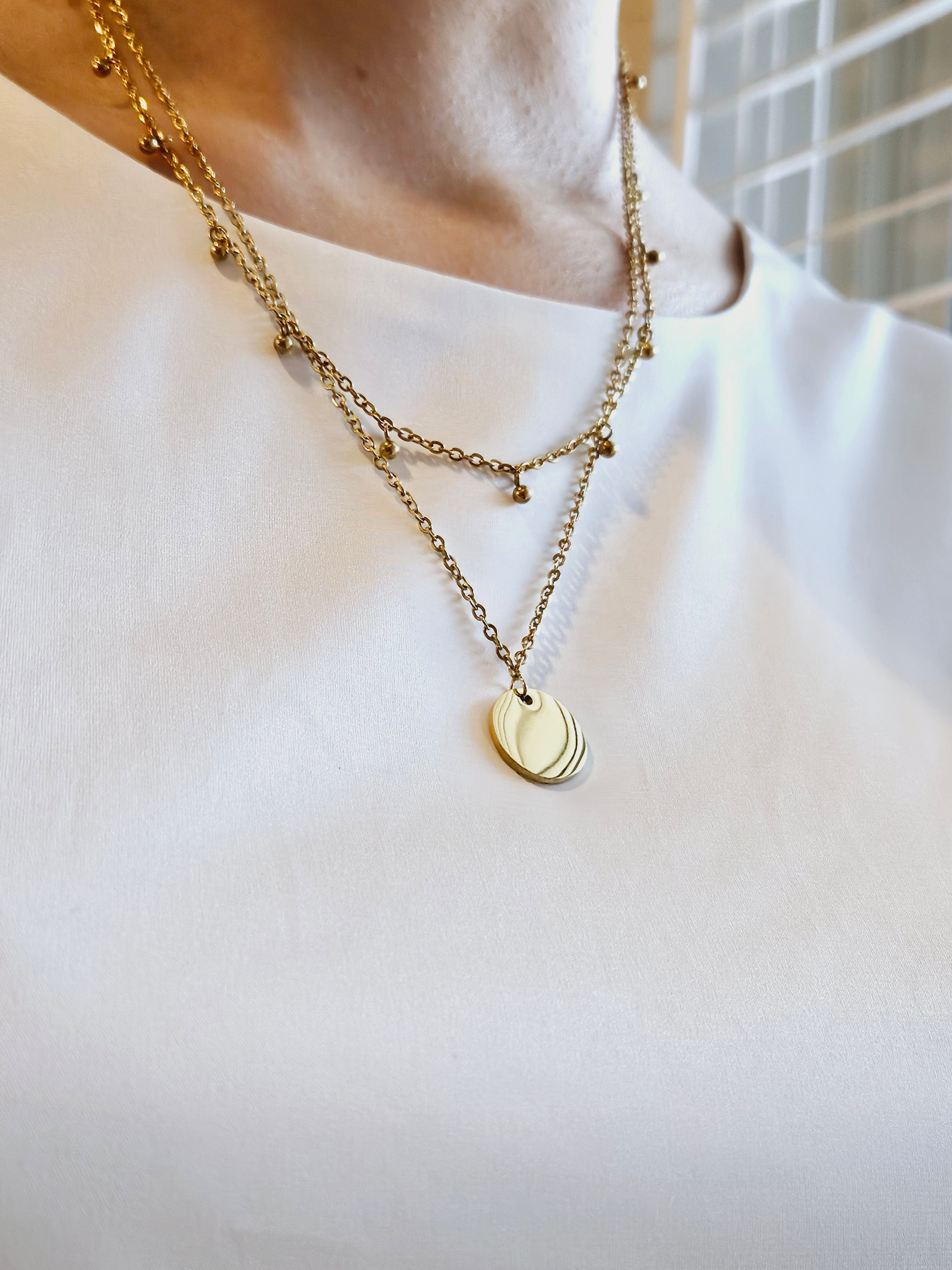 Double Layer with Medallion Pendent