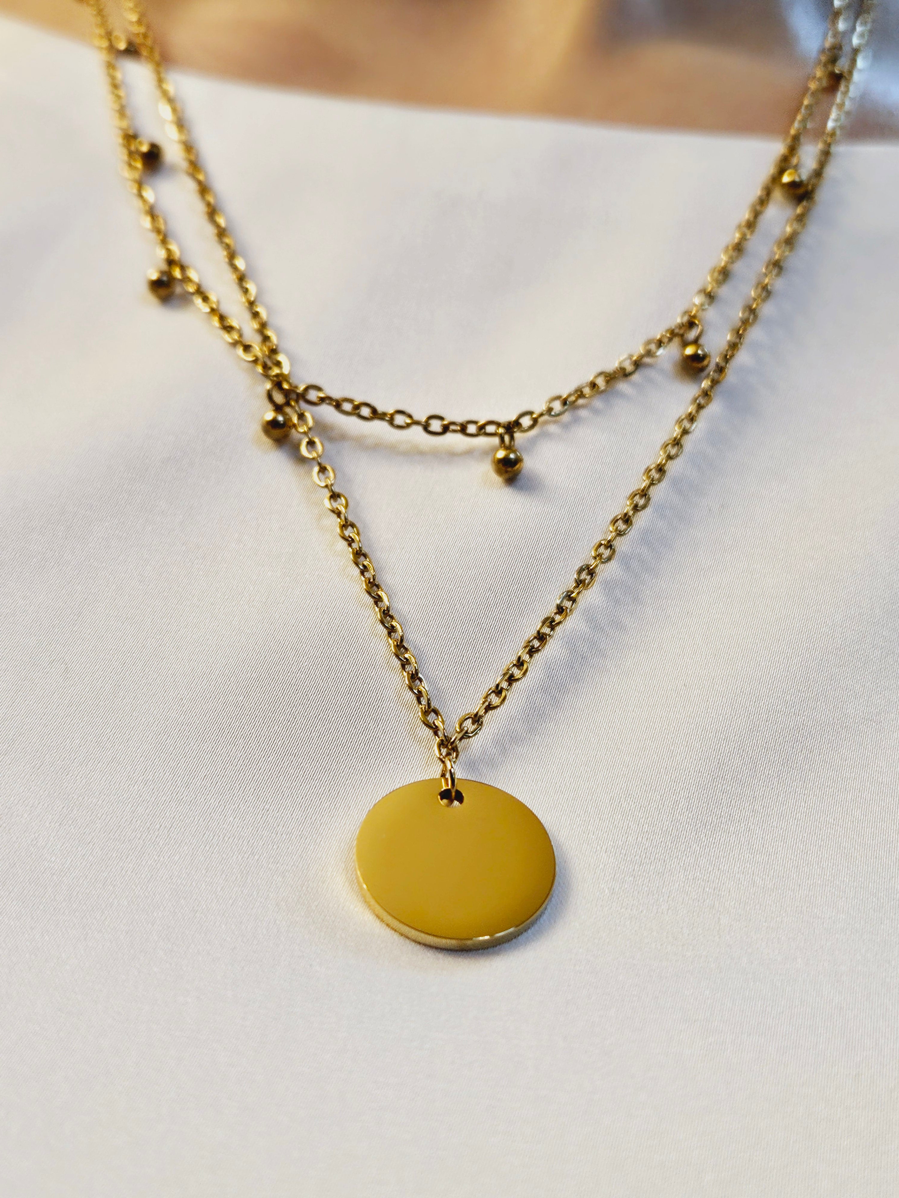 Double Layer with Medallion Pendent